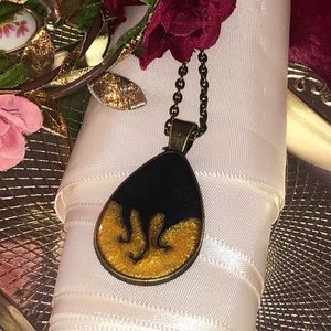 Gold and black crystal resin teardrop pendant